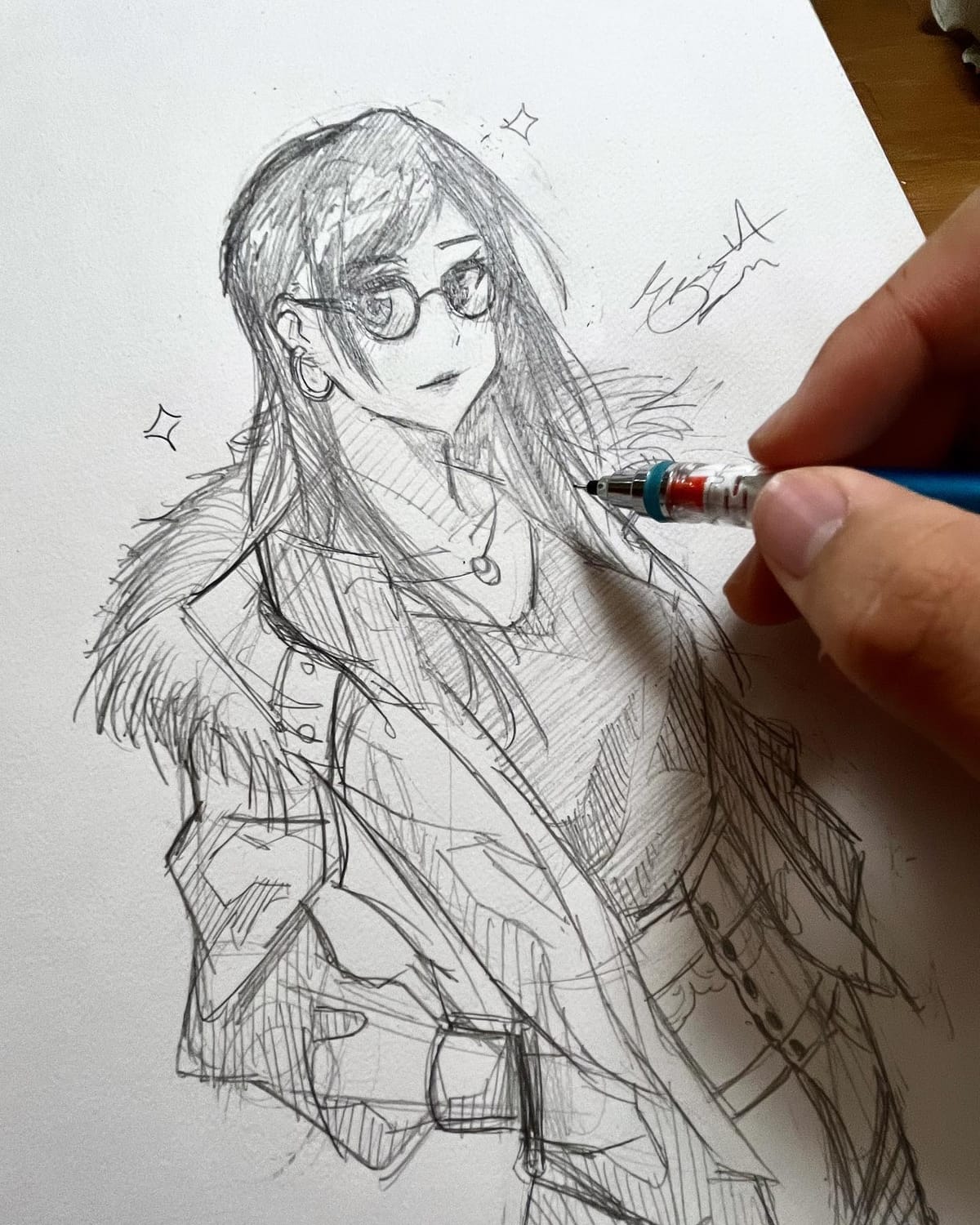 Mechanical-pencil sketch of a long-haired girl in glasses and a jacket, the artist's hand and pencil still in frame