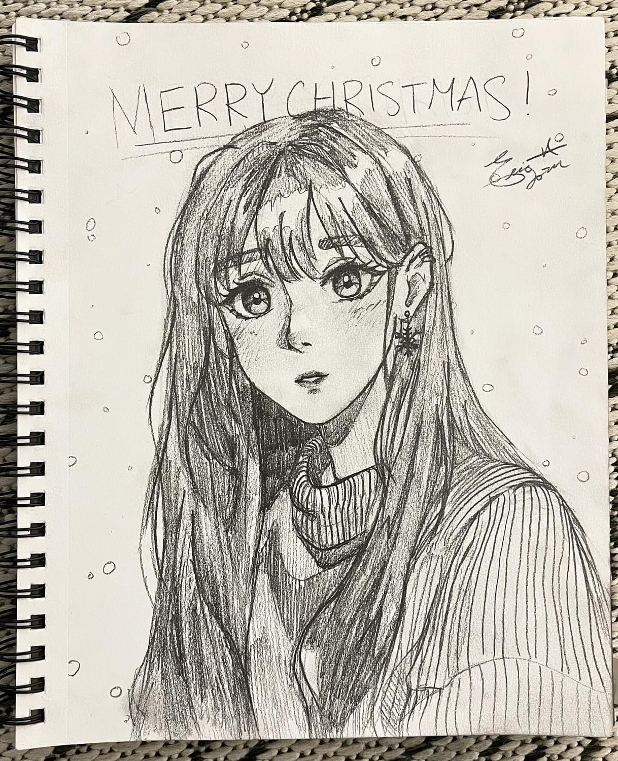 Pencil sketchbook drawing of a long-haired girl in a turtleneck beneath a hand-lettered “Merry Christmas”, a 2024 study of glossy hair
