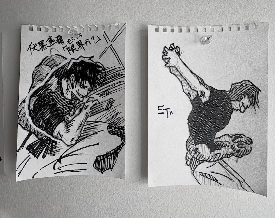 Two ink drawings of Toji Fushiguro from Jujutsu Kaisen pinned side by side on a wall